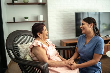 Nurse holding patient's hands