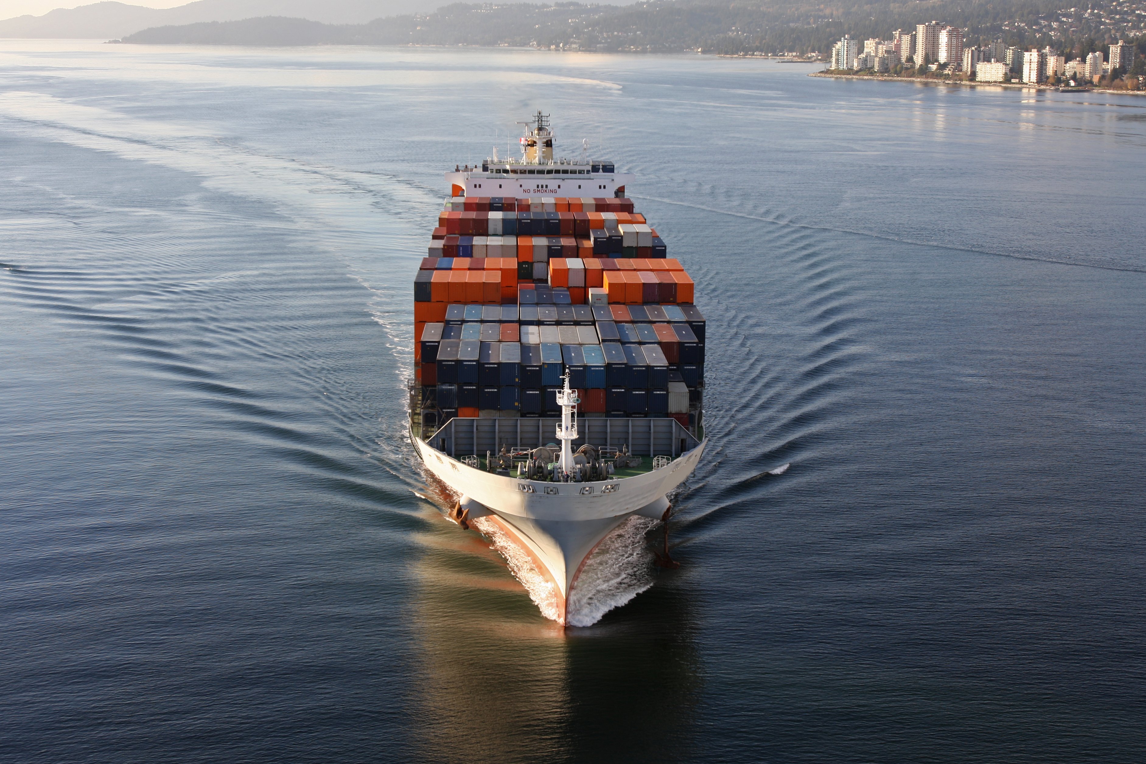 Frontal view of a heavy laden container ship