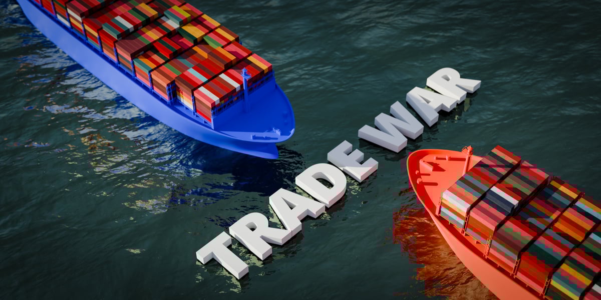 A blue boat and a red boat filled with merchandise approach each other, with the words "trade war" separating them.