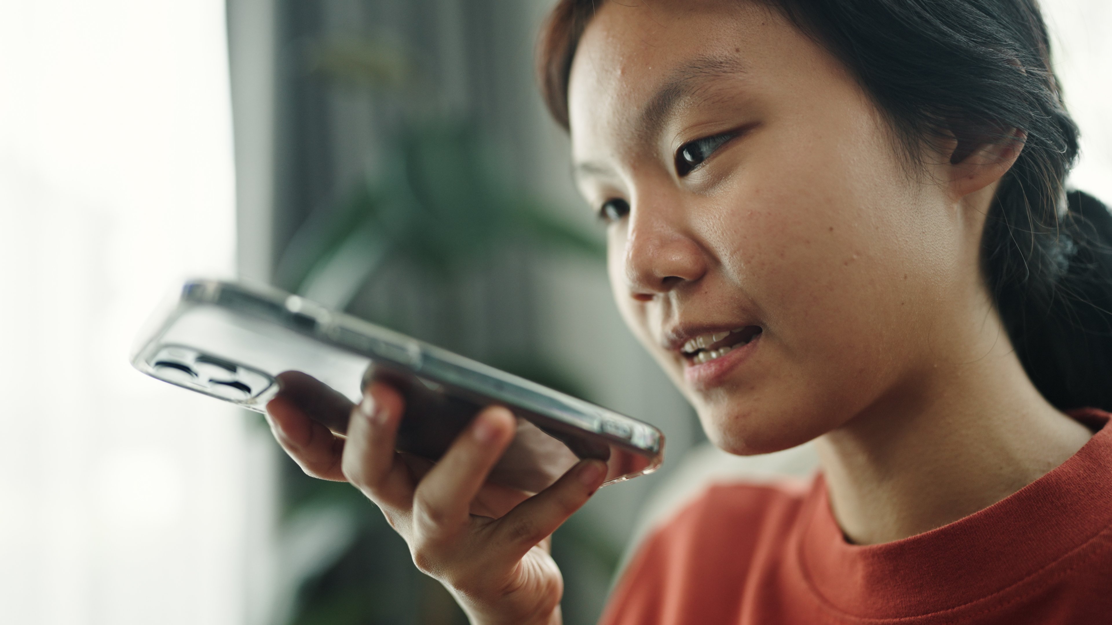 person uses speaker on a smartphone