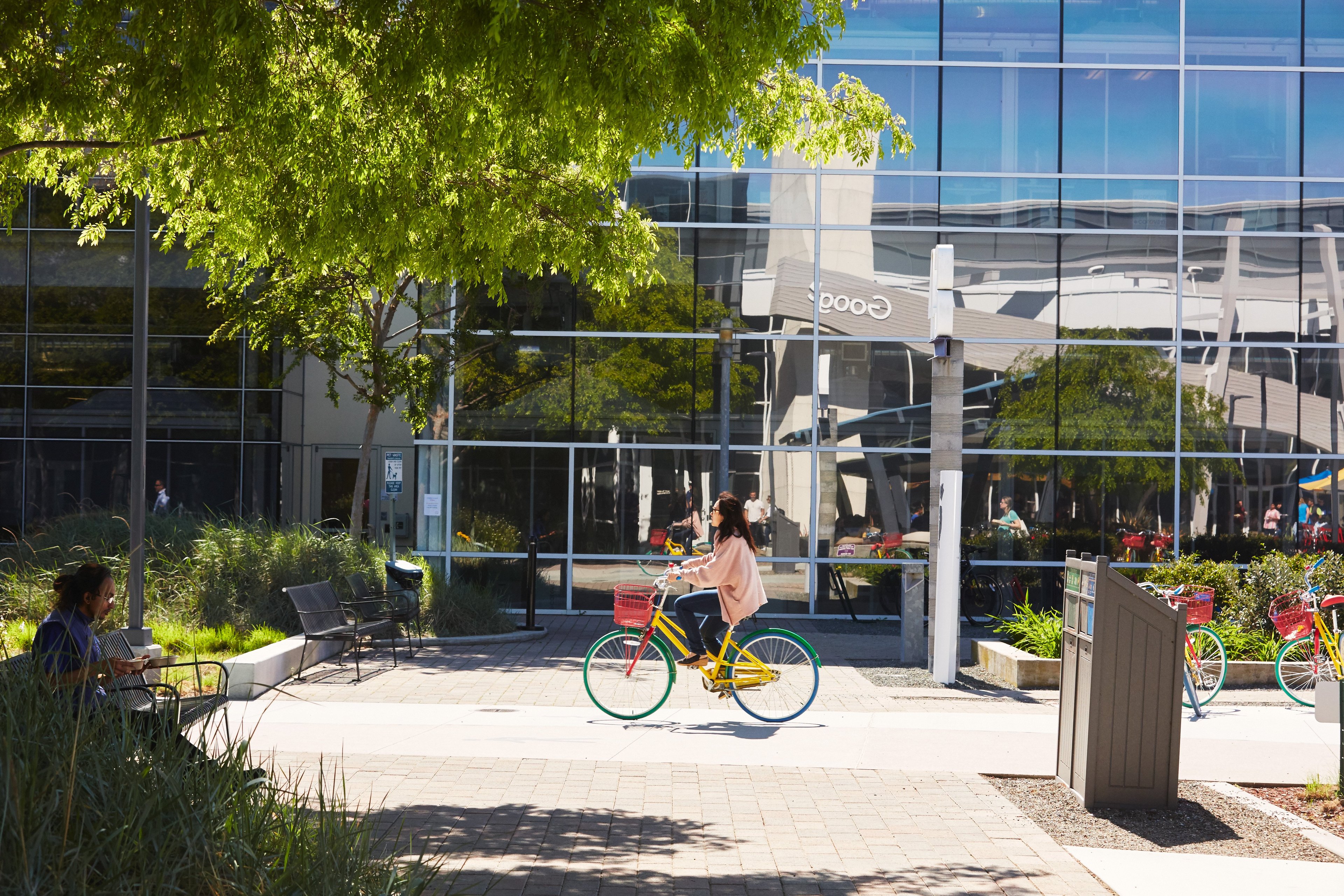 A Google employee rides a bicycle at the Googleplex.