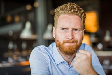 pensive investor looks into camera