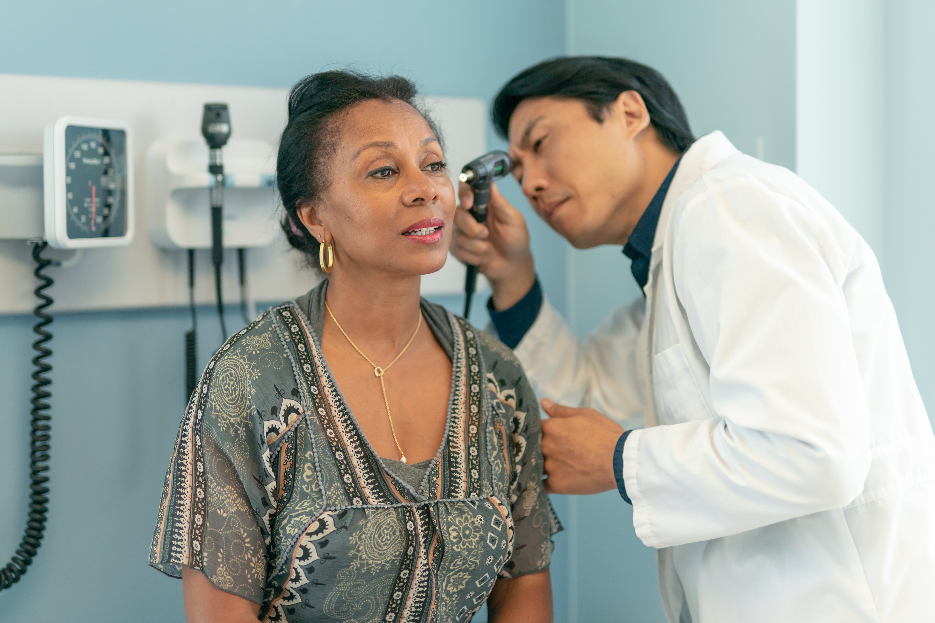 Women having ears checked by a doctor.