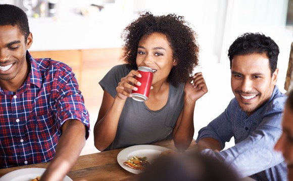 A group of friends share a meal at a restaurant.