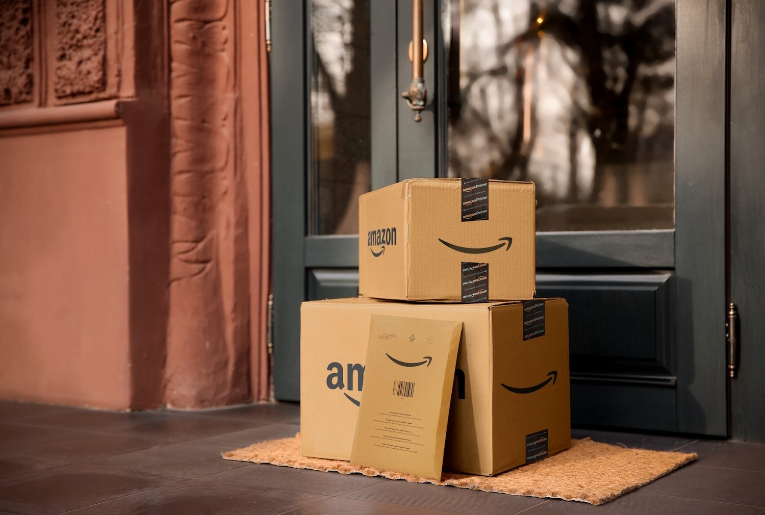 Amazon boxes in front of a door.