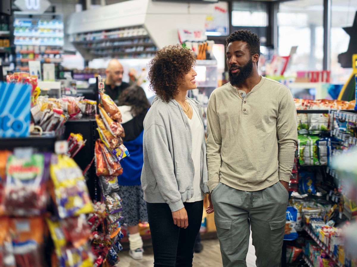 Two people shopping in a store.