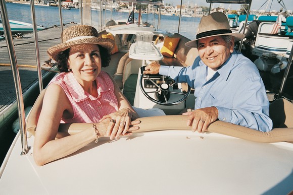 Retired couple enjoying the day on a boat. 