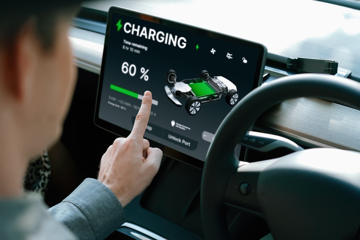driver charging an electric car.