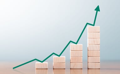 stacks of wooden blocks forming a rising chart