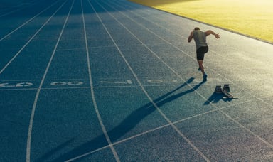 man sprinting on empty track (1)