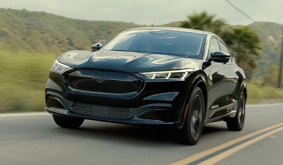 A black car on a road.