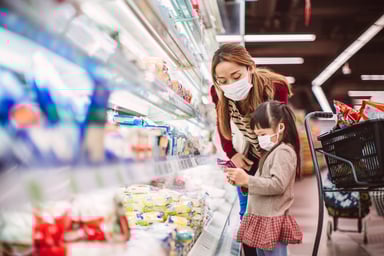 Adult and child shopping in a store