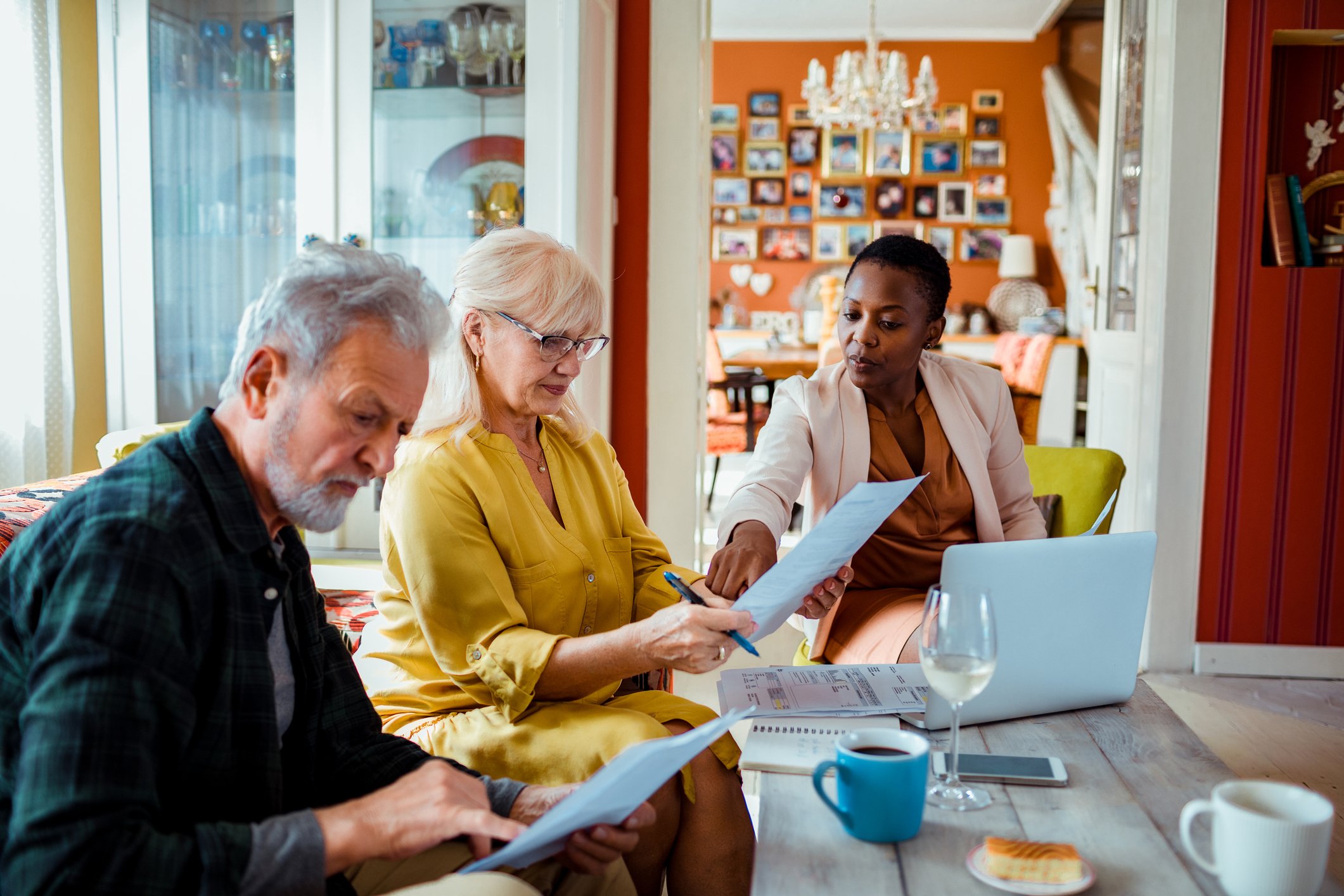 financial-advisor-with-clients-getty