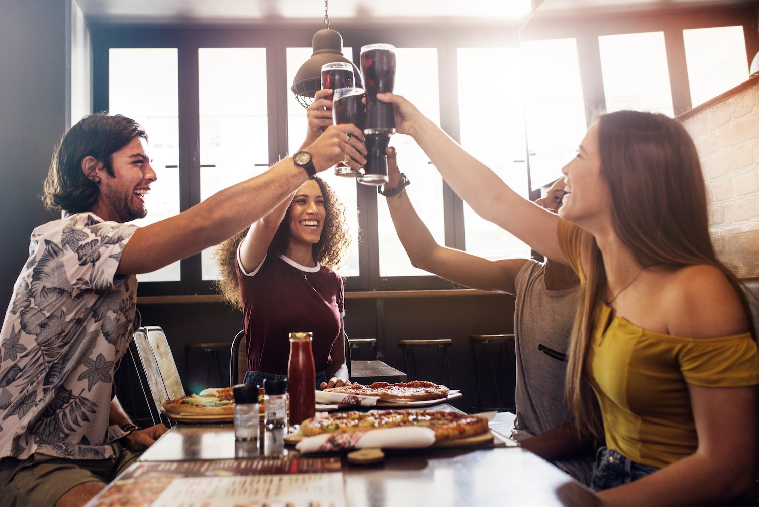 friends share cola at restaurant