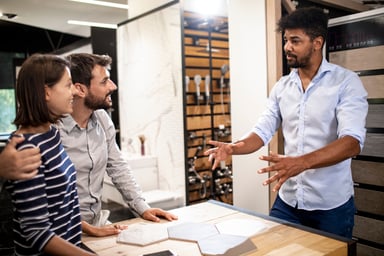 People buying tiles at a furniture store