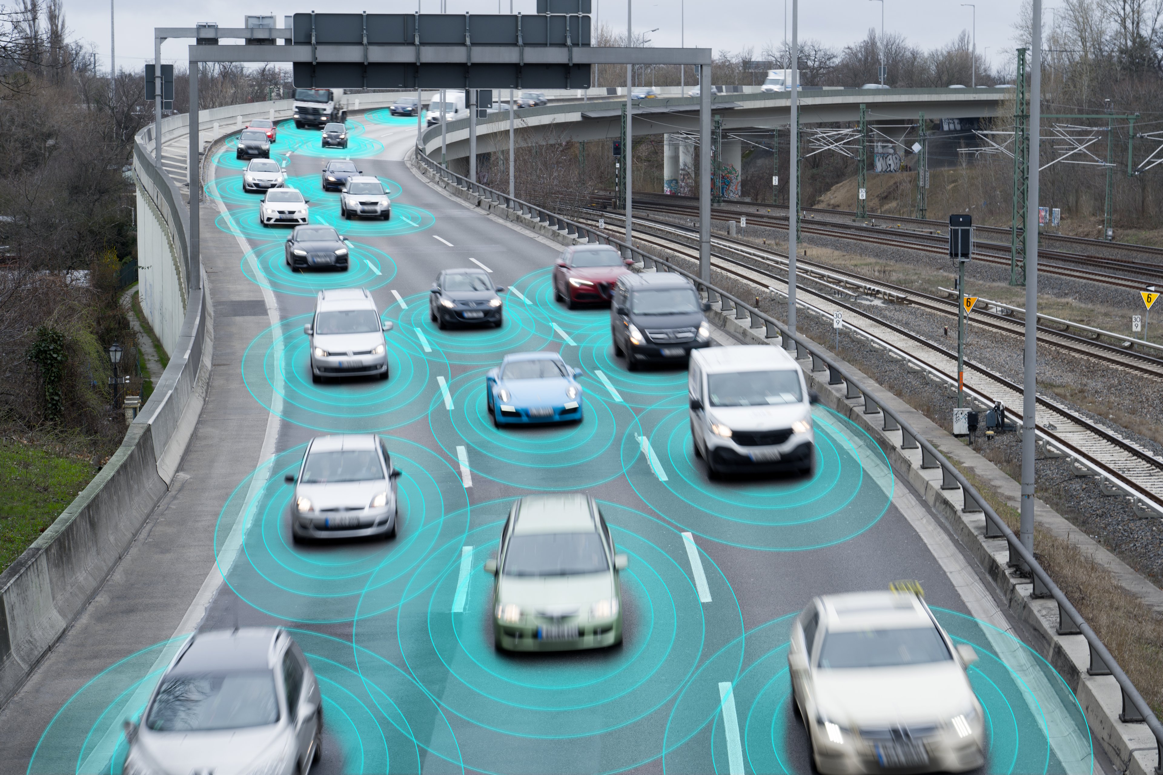 Vehicles on a highway with green sensing circles around them. 