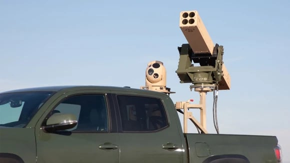 The VAMPIRE missile system mounted to the bed of a Toyota pickup.