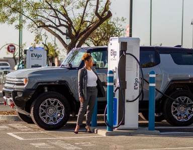 EVgo charger with EV driver and SUV