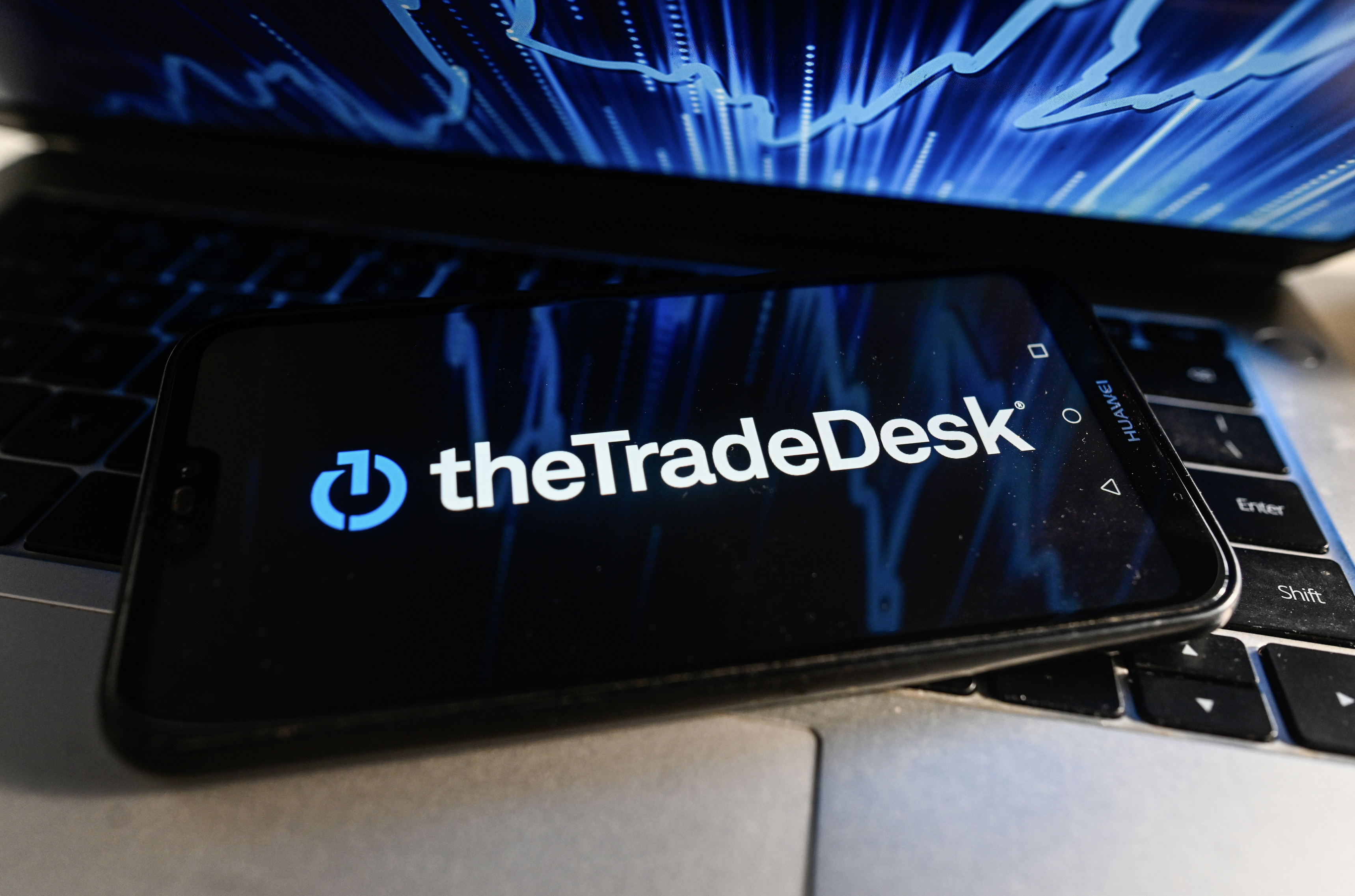 The Trade Desk corporate logo displayed on a smartphone.