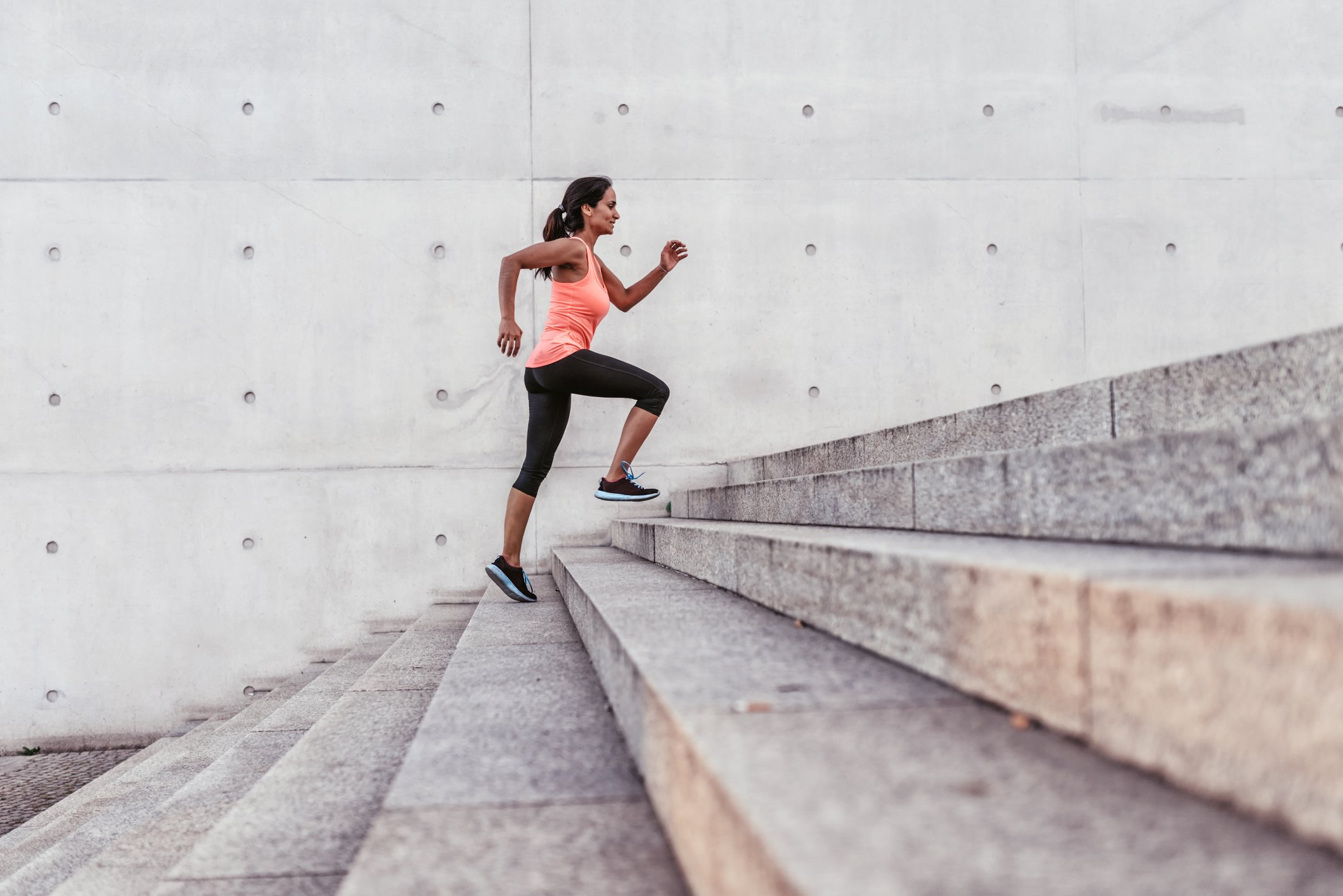 A runner going up a flight of stairs.