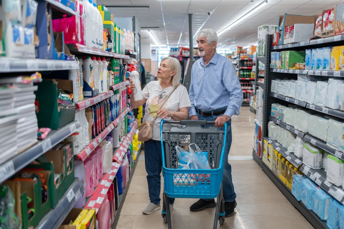 Two people shopping in a store.
