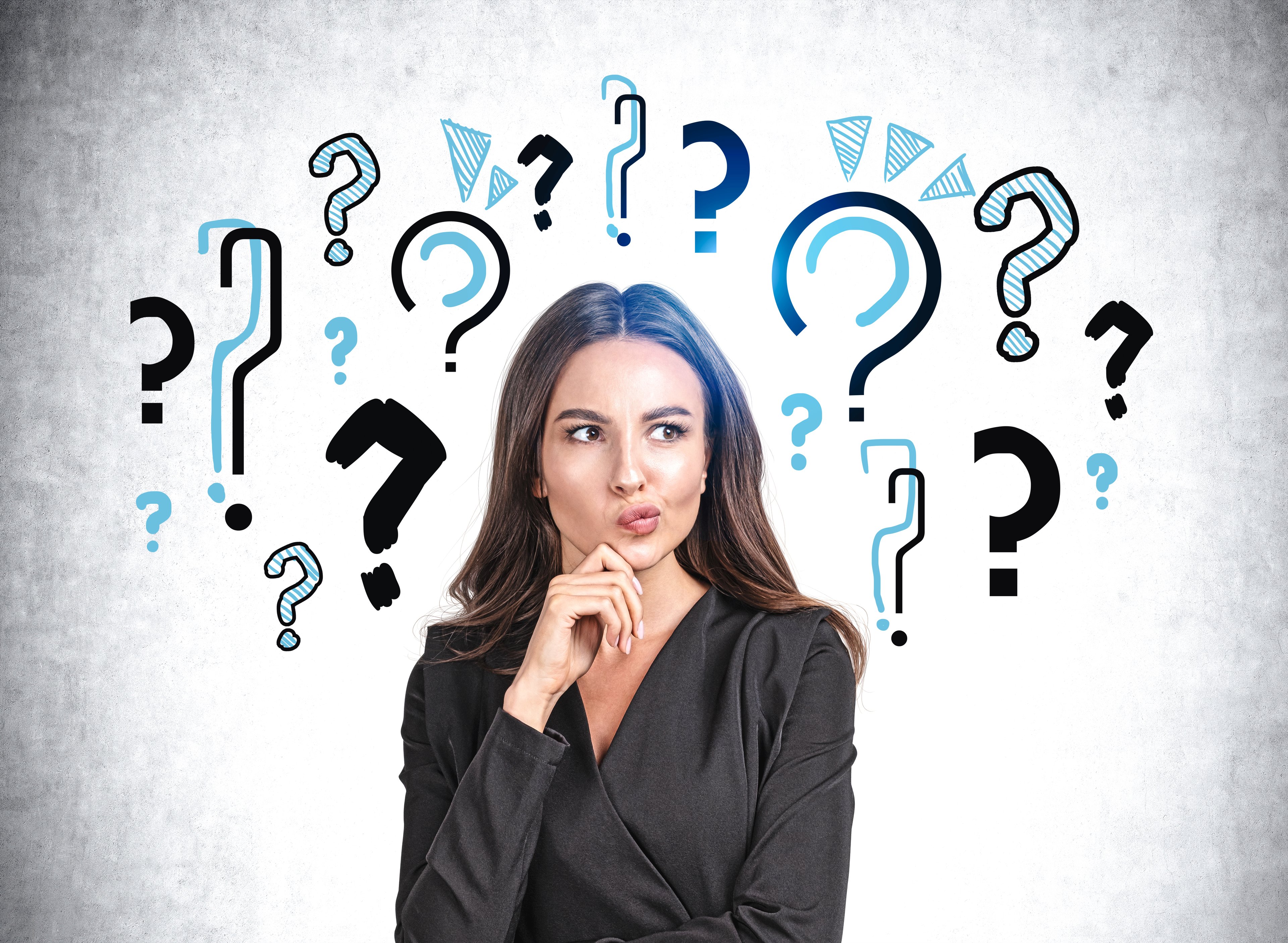 Question marks surround head of person who looks like they're thinking.