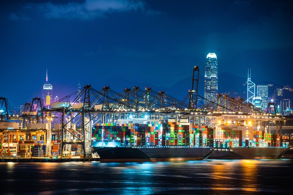 A container ship at port at night.