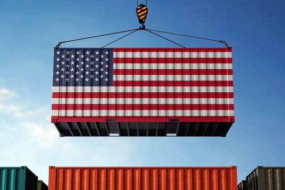 A rail container with a U.S. flag painted on it.