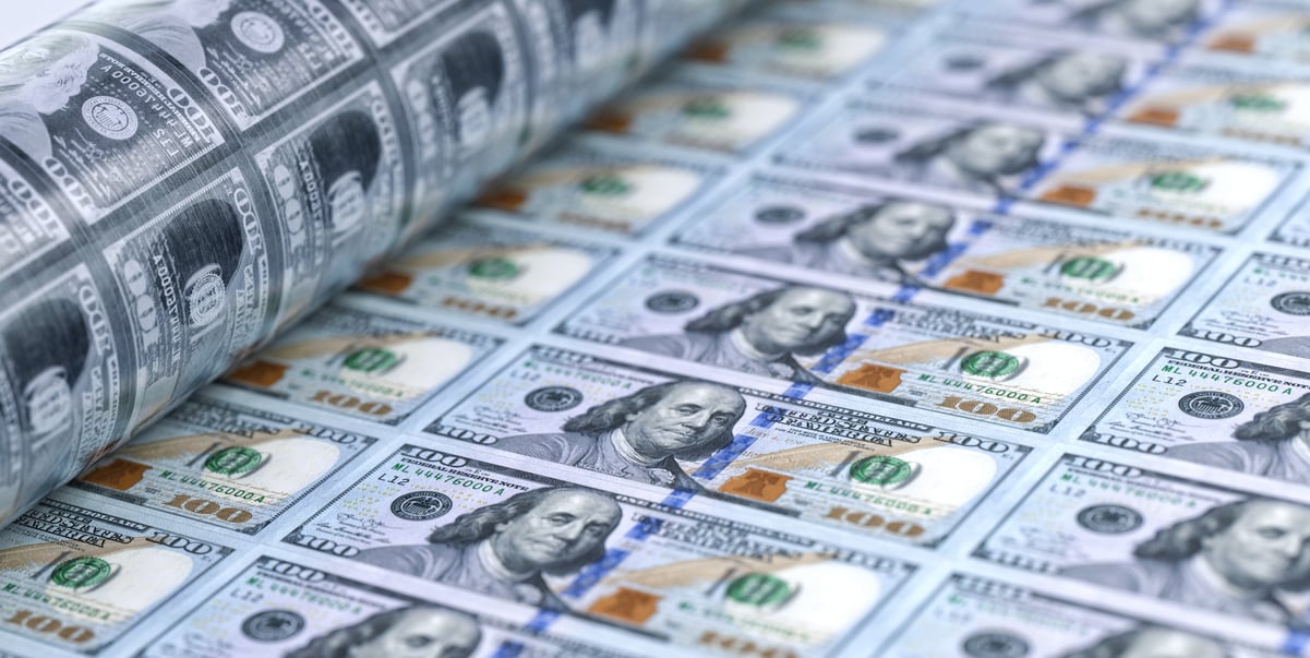 A printing press making new dollar bills.