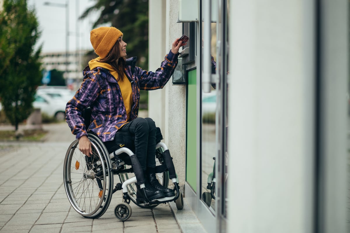 A person using an ATM.