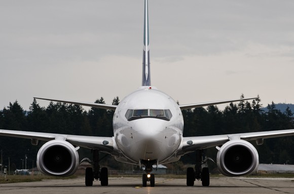 A Boeing 737 sitting on a runway.