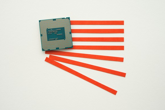 A digital chip and red lines in the form of an American flag.