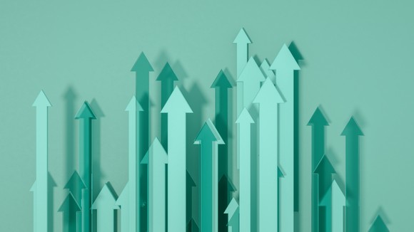 A collection of green arrows all pointing up.