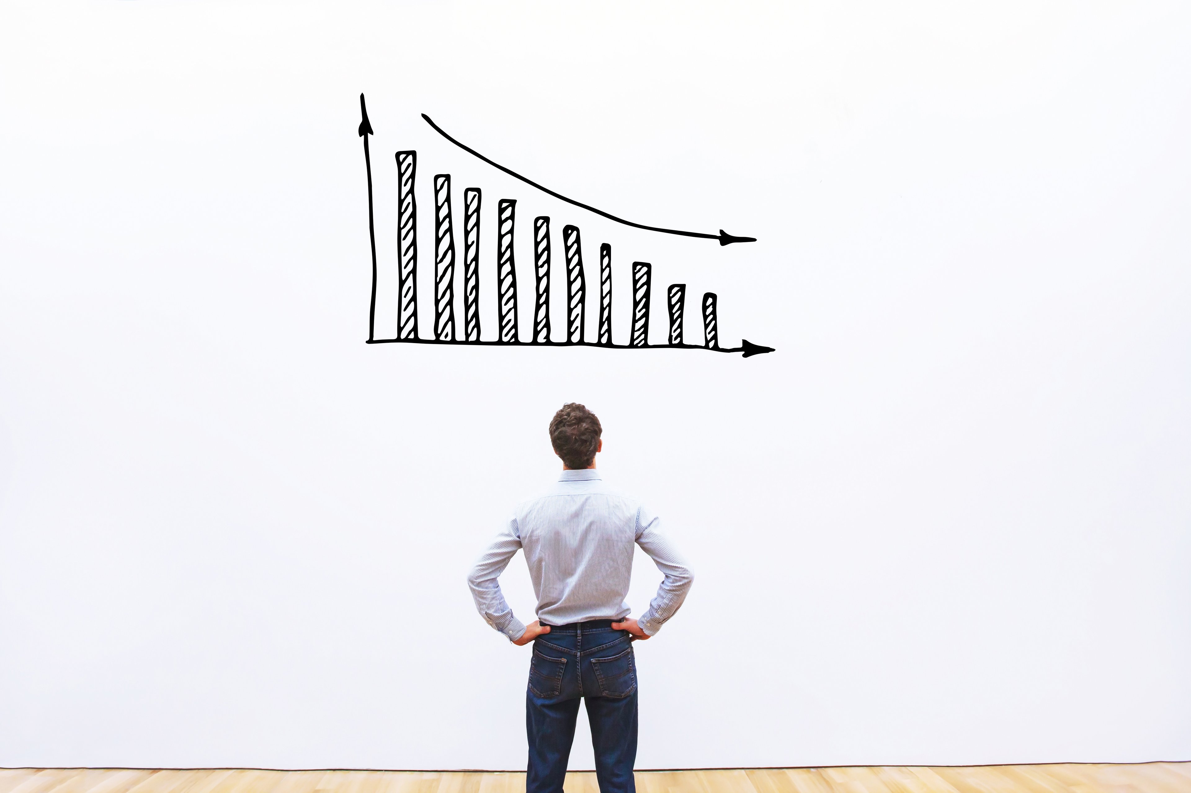 Investor staring at price decline chart