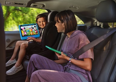 Kids using Amazon Fire device in a car