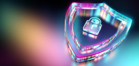 A neon-colored shield with a lock in the middle of it sits on top of a black-and-neon-colored backdrop.