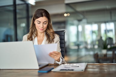 businesswoman working at a conference table.