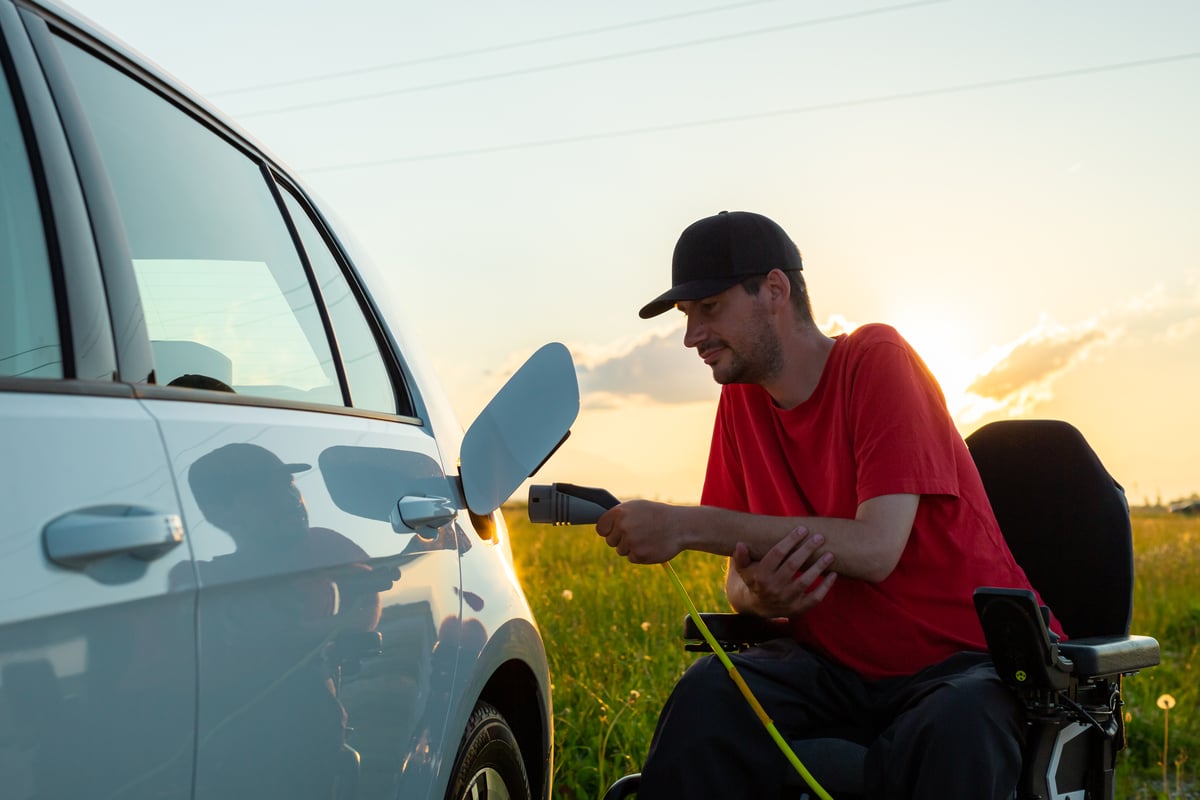 A person charging an ev