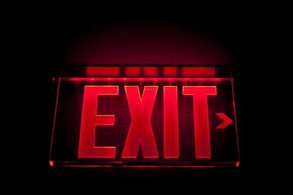 Illuminated red exit sign.
