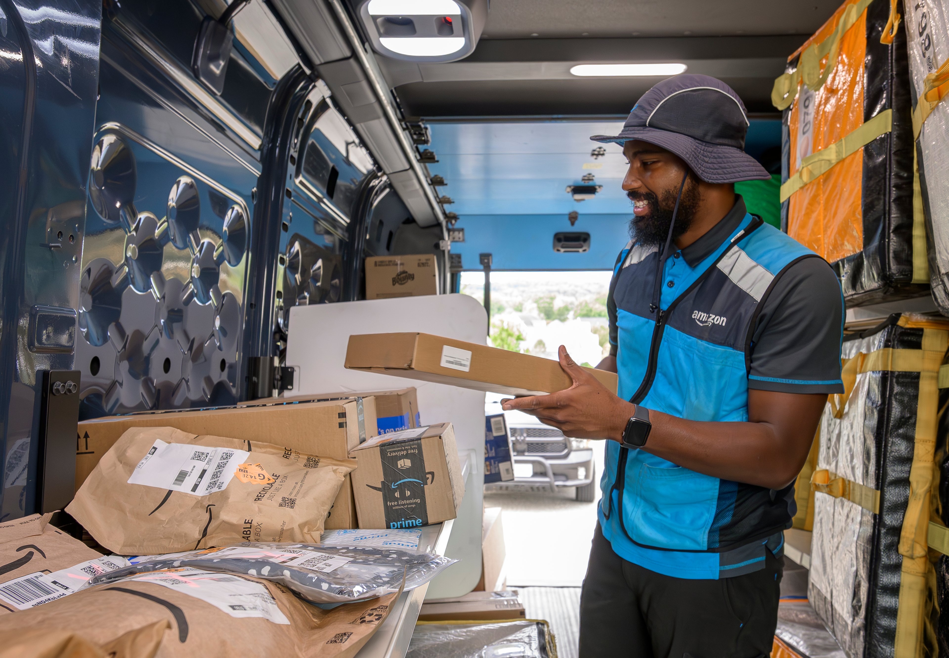 Amazon delivery person in a truck.