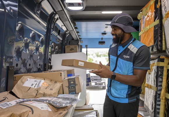 Amazon delivery person in a truck.