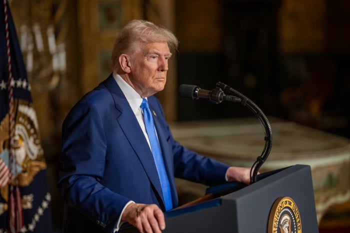 President Trump is shown at a podium.