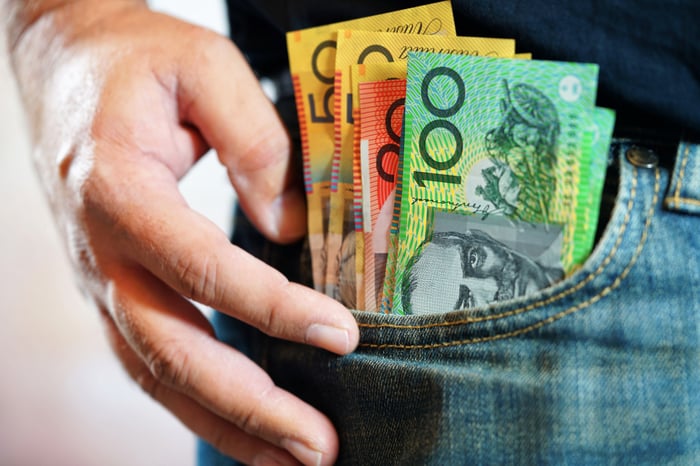A person with dollar notes in pocket.