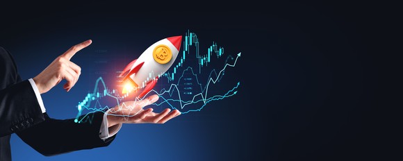 Chart lines and a person pointing toward a rocket launching from their hand. 