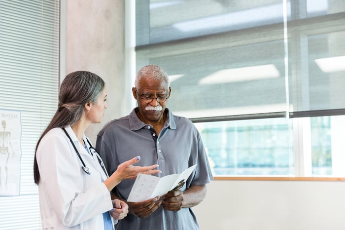 Doctor talking to patient.