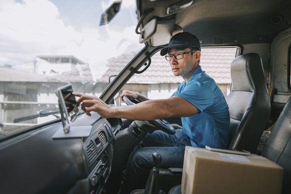 A delivery driver in a truck.