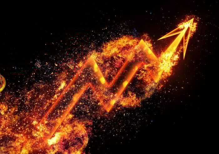 A flaming chart arrow moving up and to the right.