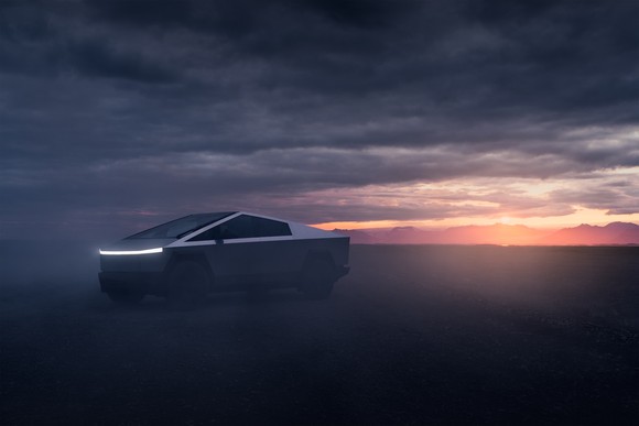 A Tesla Cybertruck at dusk.