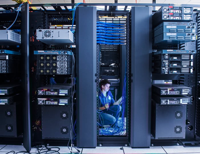 A technician works on a computer system.