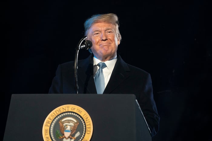 President Donald Trump delivering remarks from behind the presidential podium.